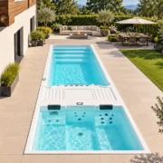 Swim Spa Infinitas SP6200 vollversenkt auf der Gartenterrasse mit Schwimmbereich und Whirlpool-Bereich